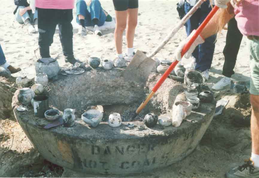 A careful examination of the pit is done to remove all pottery fired