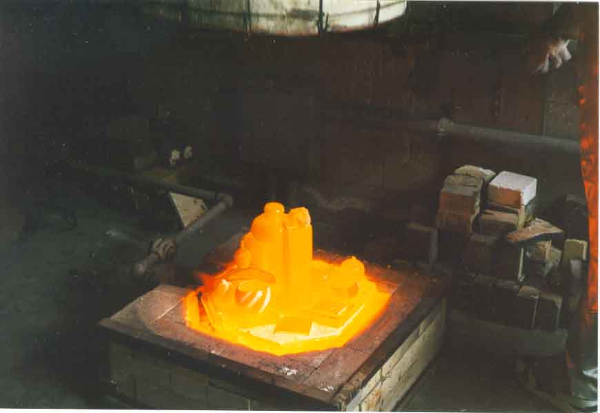 Raku kiln that has reached cone temperature and ready for the pottery to be placed into reduction containers